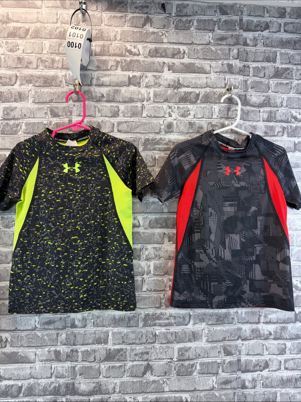 2 Under Armour Kids' fitted shirts